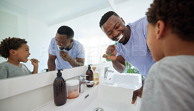 Buy stock photo Smile, brushing teeth and father with son in bathroom for dental, morning routine and cleaning. Teaching, self care and toothbrush with black man and child at home for family wellness and hygiene
