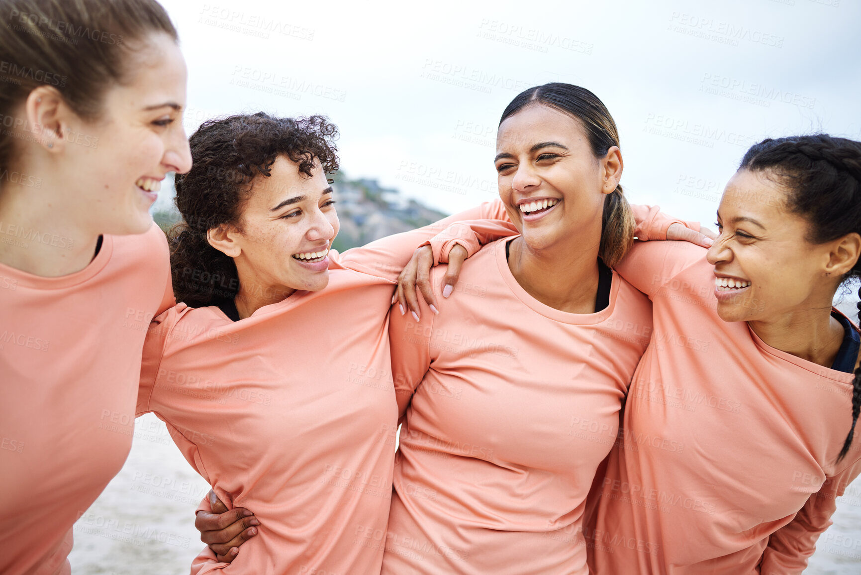 Buy stock photo Friends, cheerful women and beach with hug for comic laugh, happy team and motivation for smile, support and diversity. Gen z athlete group, embrace and funny with solidarity, exercise and wellness