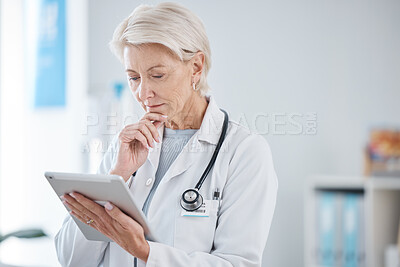 Buy stock photo Healthcare, tablet and senior doctor thinking in hospital for online consulting, telehealth and wellness app. Clinic, medicine and woman on digital tech for internet, medical research or patient data
