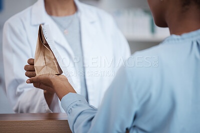 Buy stock photo Hands, pharmacy and customer shopping for medicine, product or medication. Healthcare, wellness and black woman buying pills, supplements or medical drugs from pharmacist in drugstore or retail shop.