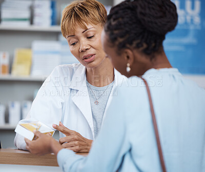 Buy stock photo Healthcare, advice and black woman with pharmacist at counter for help on safe medicine and prescription drugs. Health, pharmaceutical info and patient consulting medical professional at pharmacy.