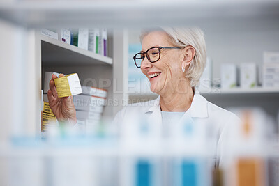 Buy stock photo Pharmacy, pharmacist and senior woman with medicine, pills or box in drugstore. Healthcare, wellness or happy medical doctor laughing and reading label on medication or drugs, vitamins or supplements