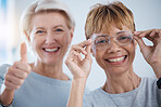 Portrait, thumbs up and senior women with glasses for vision, optometry or wellness in optics store. Healthcare face, hand emoji and smile of happy female with optometrist for success, ok or approval
