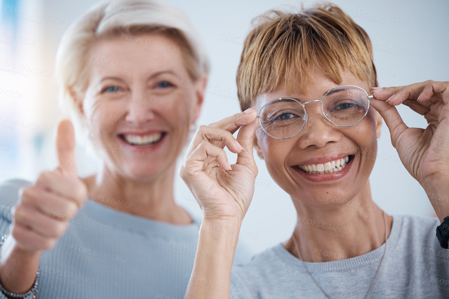 Buy stock photo Portrait, thumbs up and senior women with glasses for vision, optometry or wellness in optics store. Healthcare face, hand emoji and smile of happy female with optometrist for success, ok or approval