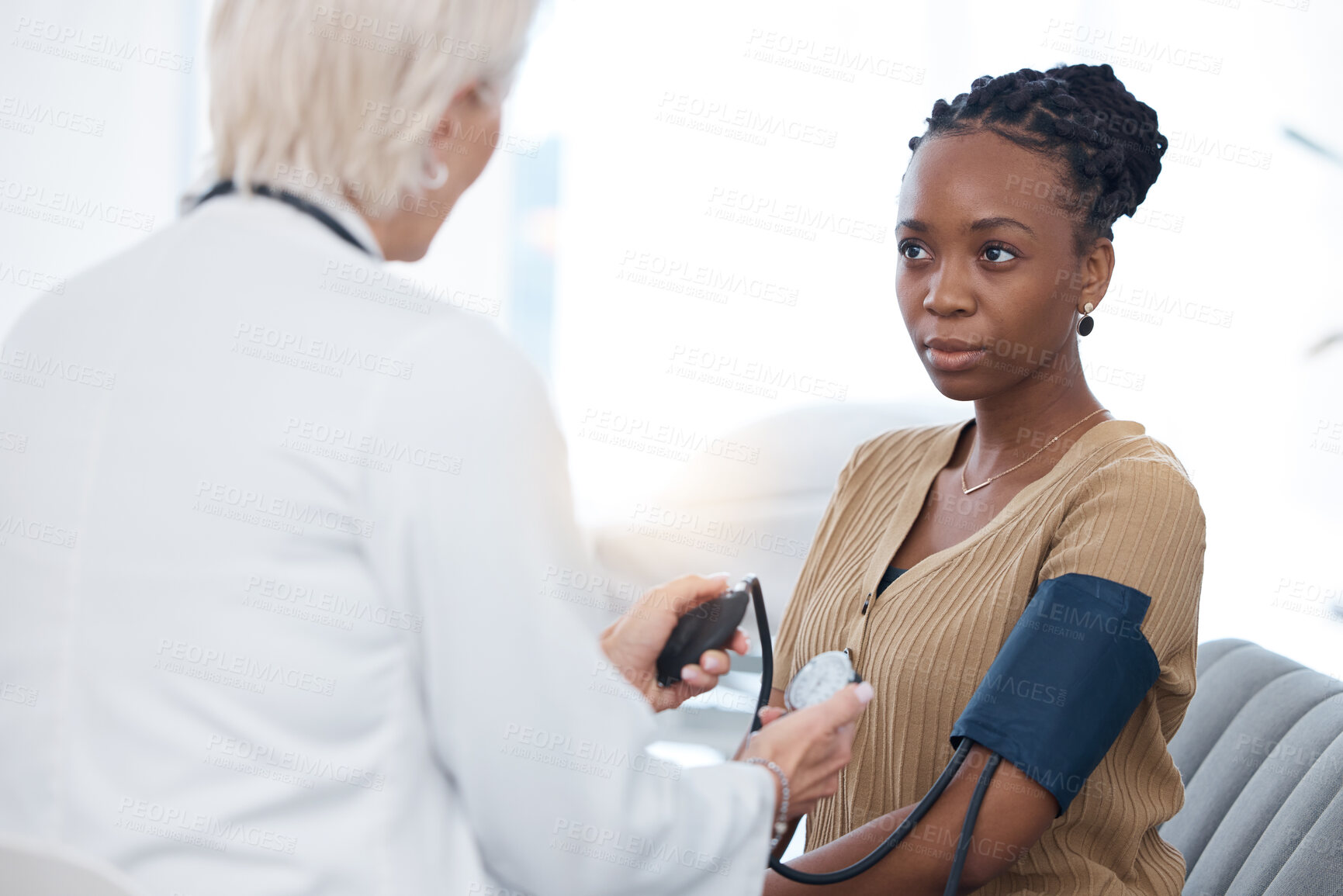 Buy stock photo Healthcare, checkup and black woman with a doctor for blood pressure, hypertension and cardiology. Medical, service and African patient with a gp for a routine consultation to monitor the heart