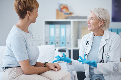 Buy stock photo Consulting, healthcare and woman speaking to a doctor about a surgery, medical attention or plan. Support, medicine and mature patient talking to a gp about cardiology, strategy or health advice