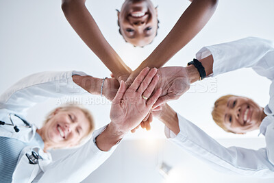 Buy stock photo Doctor, group and stack hands in circle for teamwork portrait, happiness or support in hospital for healthcare goal. Doctors, clinic team and huddle for motivation, solidarity or diversity with women