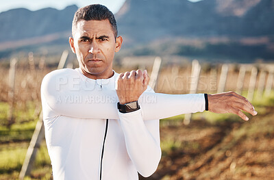 Buy stock photo Man, stretching arms and fitness outdoor, portrait with hiking or running in countryside, exercise and warm up. Ready, face and serious, muscle and strong male, start with marathon or trekking
