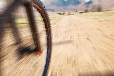 Buy stock photo Cycling wheel, motion blur and fitness in nature, countryside and training of triathlon, sports and power. Closeup bicycle, speed and outdoor adventure for off road freedom, bike exercise and action