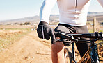 Man hands, gloves and bicycle cycling for training, triathlon sports and cardio transportation. Closeup cyclist, bike gear and outdoor exercise for fitness, performance athlete and off road freedom 