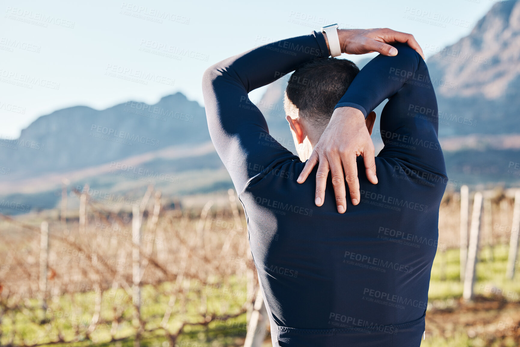 Buy stock photo Man, stretching before run and fitness outdoor, back view with hiking or running in countryside, exercise and warm up. Arms, muscle and strong male runner, start with race for marathon or trekking