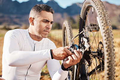 Buy stock photo Cycling, fixing and wheel with man in nature for sports, wellness and fitness training. Insurance, safety and tire change with cyclist and repair mountain bike on trail for broken, puncture and check