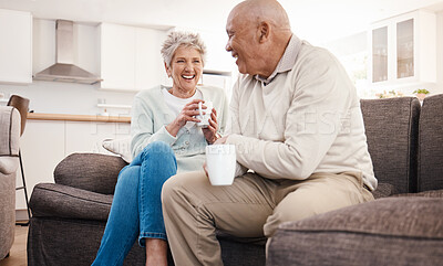 Buy stock photo Love, coffee and elderly couple relax on a sofa, happy and laughing, talking and bonding in their home. Tea, chill and senior man and woman enjoying retirement, relationship and humor in living room