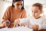 Home school, learning and mother doing an activity with her child for education and childhood development. Knowledge, homework and young mom teaching her toddler kid to do a creative drawing or write