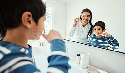 Buy stock photo Happy family, woman and boy in bathroom for brushing teeth, healthcare and bonding to start morning in house. Young kid, mother and teaching with toothbrush, smile and mirror for medical self care