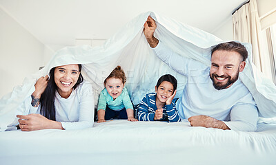 Buy stock photo Family, portrait and blanket fort in bed with children and parents, happy and playing in their home. Face, under and sheet by kids with mom and dad in bedroom, fun and waking up, relax and smile