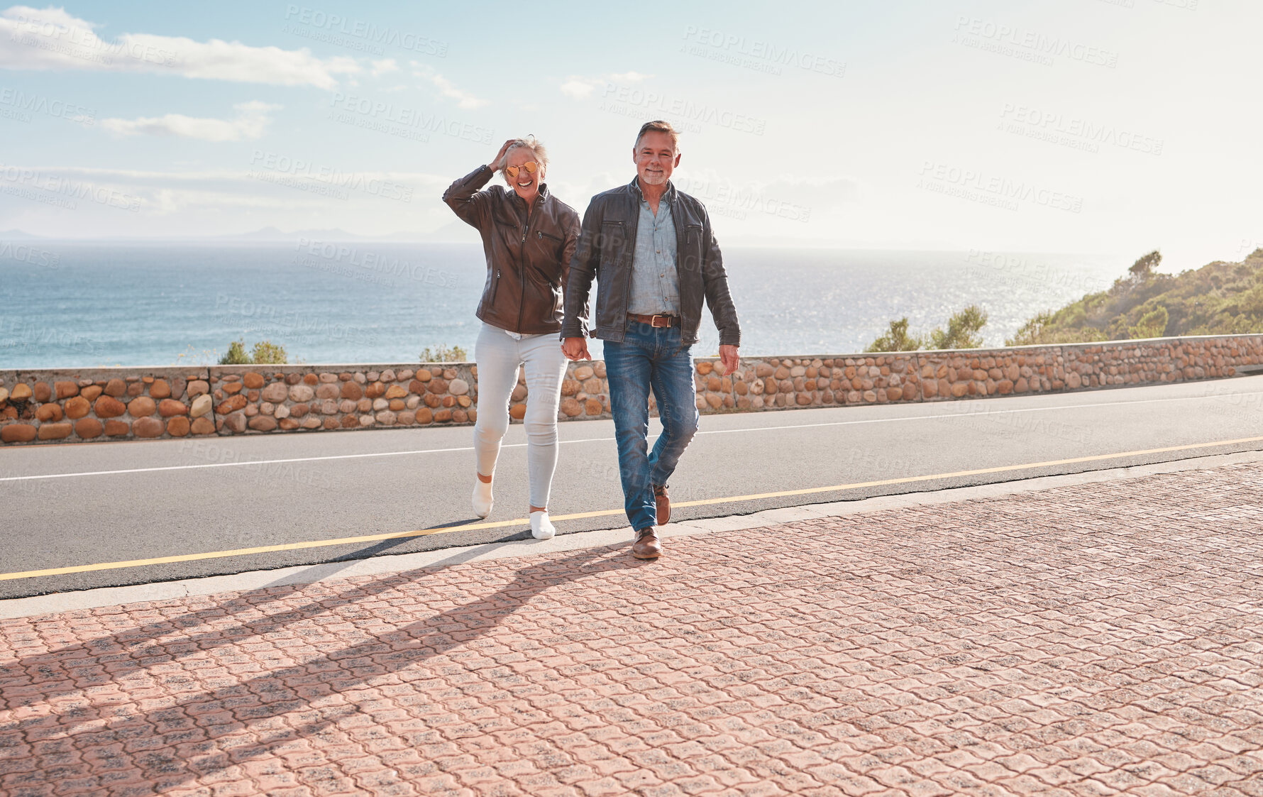 Buy stock photo Travel, road and senior couple walking enjoy holiday, adventure and vacation holding hands on mountain. Retirement, love and happy old man and woman for bonding, quality time and relax together