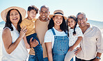 Portrait, beach and black family bonding outdoor in nature together on vacation during summer. Happy, smile or love with children, parents and grandparents on the coast or shore for a holiday
