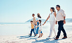 Beach, walking and mock up with a black family holding hands outdoor in nature by the ocean at sunset together. Nature, love or kids with grandparents, parents and children taking a walk on the coast