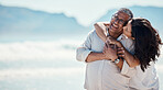 Love, romance and mature couple on beach, embrace and kiss with happy relationship and mockup. Romantic retirement vacation, senior woman and man hugging on tropical ocean holiday travel with smile.