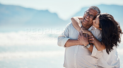 Buy stock photo Love, romance and mature couple on beach, embrace and kiss with happy relationship and mockup. Romantic retirement vacation, senior woman and man hugging on tropical ocean holiday travel with smile.
