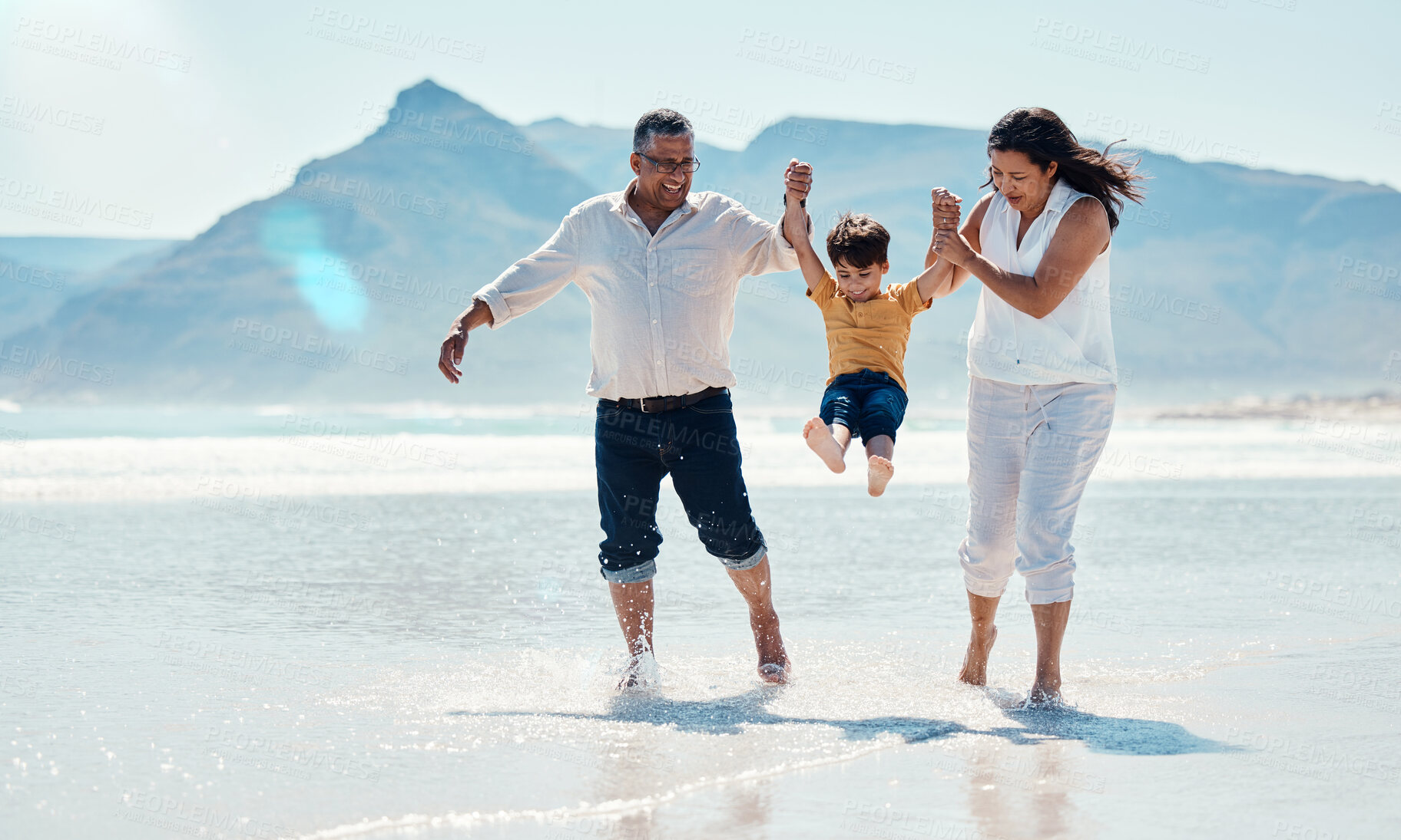 Buy stock photo Family, beach and grandparents with child for playing, quality time and adventure together. Travel, happy and grandfather, grandma and boy bonding on summer holiday, fun vacation and relax on weekend