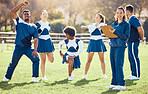 Cheerleader, coach portrait or cheerleading team with support, hope or faith in strategy on field. Sports mission, fitness or cheerleading group in stretching warm up together by happy woman outdoors