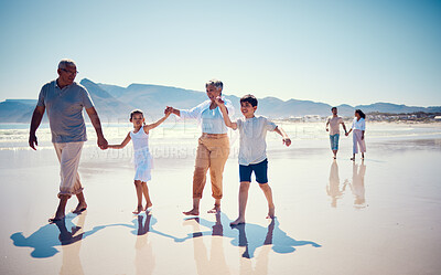 Buy stock photo Beach, family holding hands and grandparents with children playing and walking on ocean sand together. Fun, vacation and senior man and woman with kids bonding, quality time and summer walk in nature