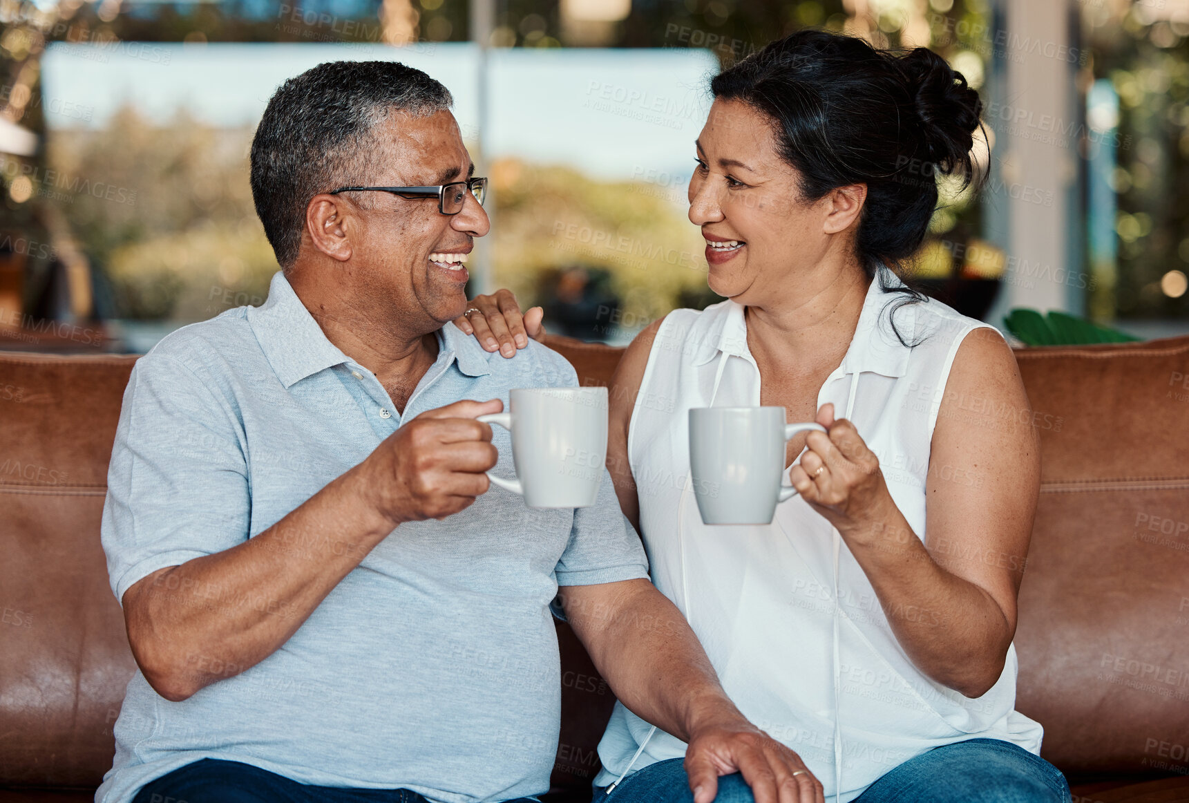 Buy stock photo Toast, coffee and senior couple laughing in home, having fun and enjoying funny conversation. Love bonding, tea cheers and romantic smile of happy, retired and elderly man and woman drinking espresso