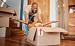 New home, father and pushing girl in box, having fun and bonding after moving in house. Real estate, family property and child with teddy bear, boxes and happy dad playing to celebrate relocation.