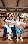 Parents, kids and grandparents on sofa for portrait with love, care and vacation together in lounge. Old man, women and grandchildren in living room with happiness, hug and relax on couch for holiday