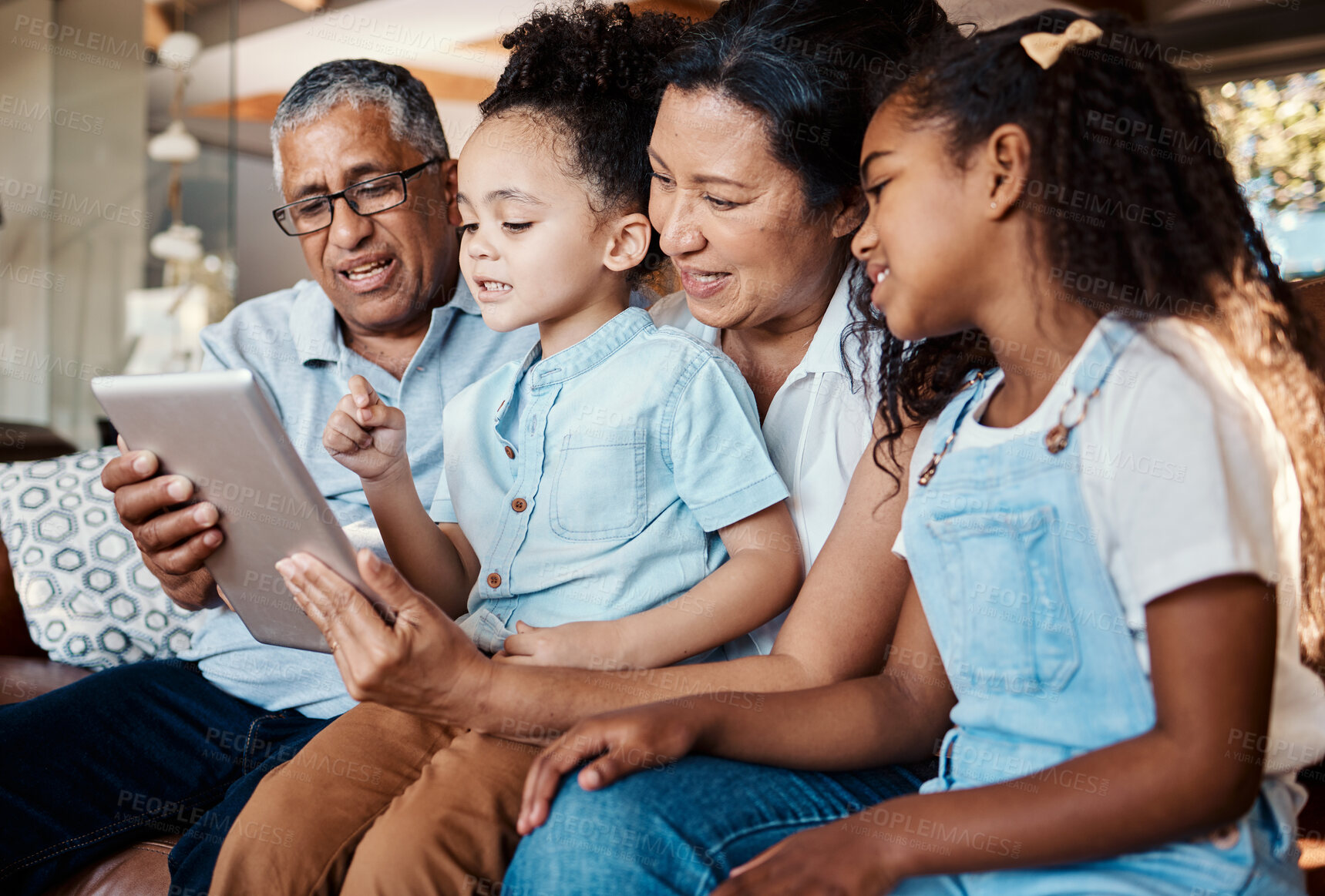 Buy stock photo Relax, family tablet and grandparents with girls on sofa in home living room for social media or video streaming. Technology, care and happy grandfather, grandma and kids bonding with touchscreen.