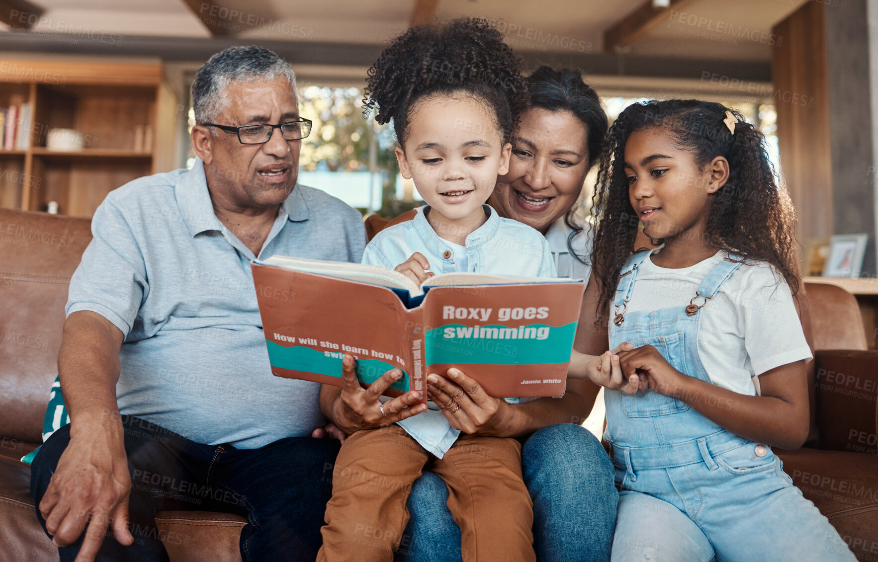 Buy stock photo Children book, reading and grandparent helping kids with learning and education on sofa. House, living room and black family on a lounge couch with happiness and books together with love and support