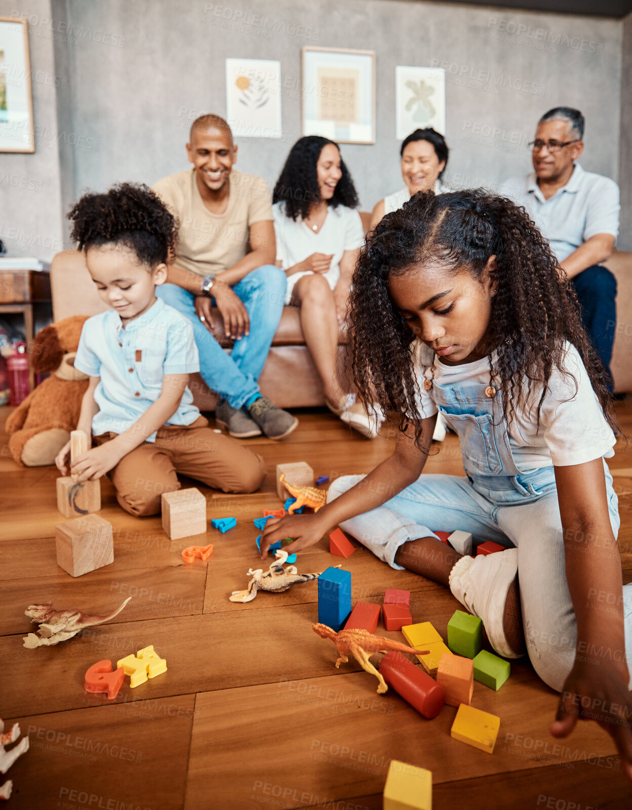 Buy stock photo Family, happy and children playing with blocks for education, learning and curiosity. Living room, playful and kids with toys for mental development, childhood and hobby with parents and grandparents