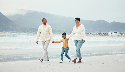 Buy stock photo Grandfather, grandma and child walking on beach enjoying holiday, travel vacation and weekend together. Big family, nature and happy grandparents holding hands for bonding, quality time and relax