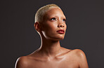 Beauty, makeup and skincare, profile of black woman in dark studio with platinum hair isolated on grey background. Art aesthetic, cosmetics and beautiful African model in glowing skin and spa facial.