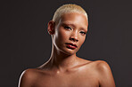 Beauty, makeup and dark portrait of black woman in studio with platinum hair isolated on grey background. Art aesthetic, cosmetics and beautiful face of African model with luxury spa facial skincare.