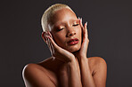 Beauty, makeup and skincare, black woman with cosmetics in dark studio with platinum hair style isolated on grey background. Art, aesthetic and relax, African model in skin glow and luxury spa facial