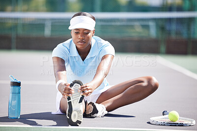 Buy stock photo Warm up, tennis and leg stretching by black woman at court for sports, fitness and training on blurred background. Exercise, preparation and foot stretch by athletic girl player on floor before match
