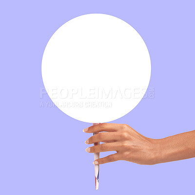 Buy stock photo Hands, billboard and circle mockup for advertising, branding or marketing against a purple studio background. Hand holding stick poster or round shape banner for message, text or brand on copy space