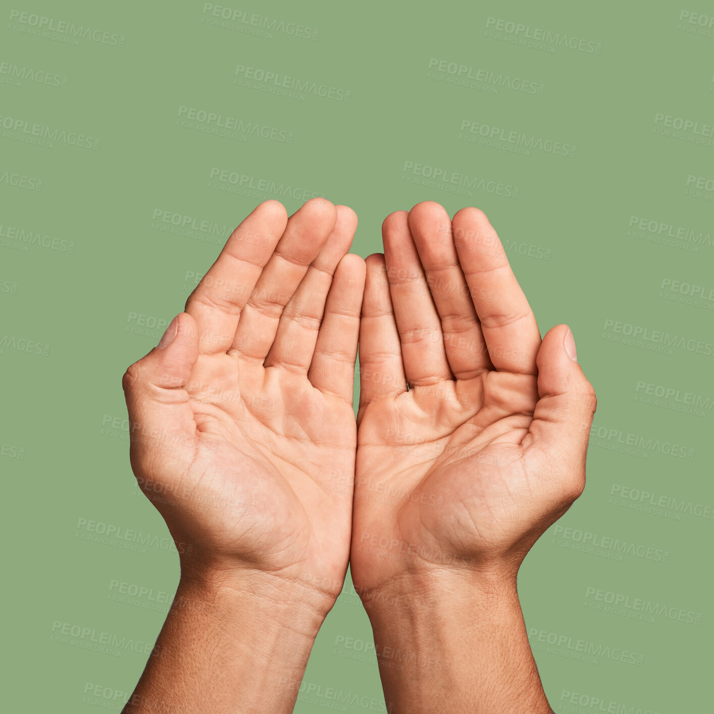 Buy stock photo Hands, welfare and poverty with a man in studio on a green background begging for help or support. Hope, community and palm cupping with a person closeup asking for humanitarian aid or kindness