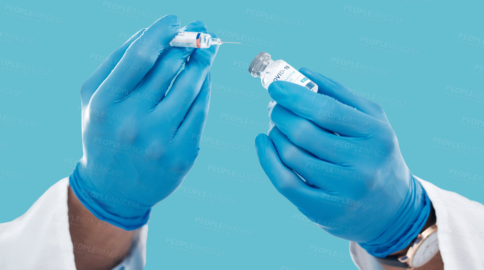 Buy stock photo Closeup, hands and needle for vaccine, healthcare and research with blue studio background. Zoom, gloves and liquid bottle with medical equipment, medicine and vial for cure, vaccination and results