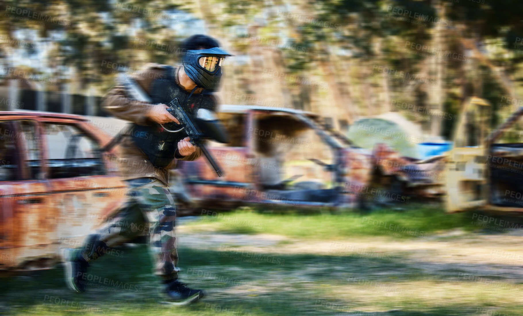 Buy stock photo Man, paintball and rush for intense battle or war in the forest running to attack on grass field. Male paintballer or soldier moving fast to push enemy defense in extreme adrenaline sports outdoors