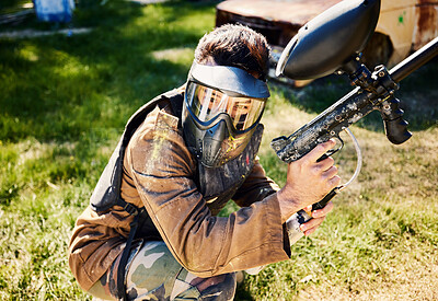 Buy stock photo Paintball, target practice or male with gun in shooting game playing with on war battlefield mission. Army training or focused soldier with weapons gear in survival military challenge competition