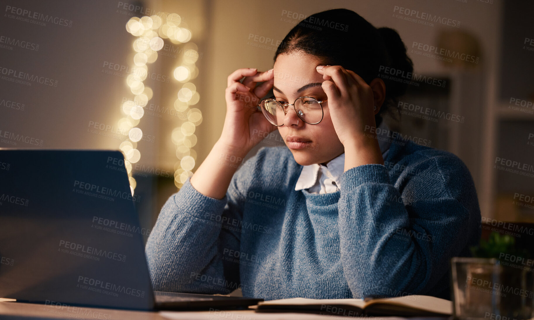 Buy stock photo Latino woman, headache and online stress at laptop of a student with learning burnout. Night, online university project and anxiety of a young female with glasses and blurred background in the dark