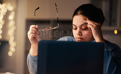 Buy stock photo Black woman, headache and home office laptop of a student with stress and burnout. Night, online university project and anxiety of a young female with glasses and blurred background in the dark