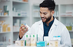 Pharmacy, medicine and shelf with man in store for healthcare, drugs dispensary and treatment prescription. Medical, pills and shopping with pharmacist for check, label information and product