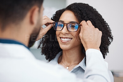 Buy stock photo Glasses, vision and optometry with a black woman customer in an optician office for consulting. Eyewear, frame and frame with a doctor or consultant helping a female patient to correct eyesight