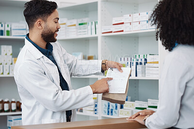 Buy stock photo Medication, prescription and explaining with a pharmacist man talking to a woman customer for healthcare. Medicine, consulting and insurance with a male health professional working in a pharmacy