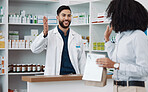 Customer service, counter and pharmacist man with medicine, expert advice or healthcare support. Happy doctor, medical professional or friendly retail person in pharmacy talking to woman at help desk